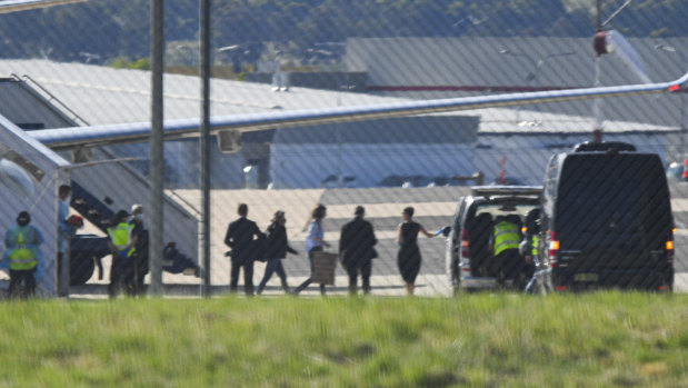 Passengers, including one believed to be British-Australian academic Dr Kylie Moore-Gilbert, leave a government jet at Canberra Airport.