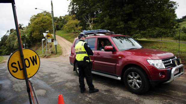 Commuters are stopped by police at the Queensland-NSW border checkpoint in the Gold Coast hinterland.