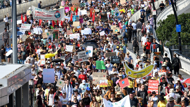 Climate change protesters are seen crossing the Victoria Bridge.