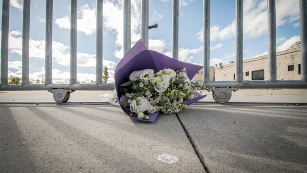 A solitary bunch of flowers at the gate of the Islamic centre in Monash on Saturday following the terrorist attack in Christchurch. 