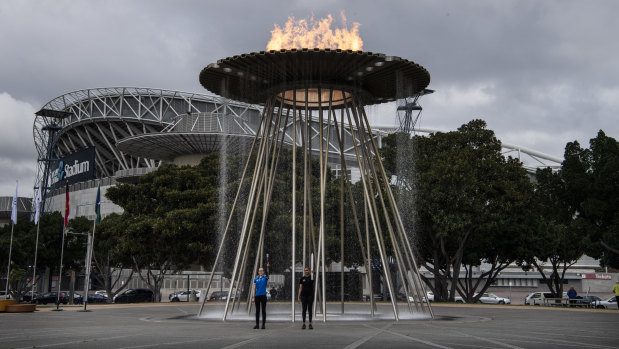 The Olympic cauldron is lit on Tuesday.
