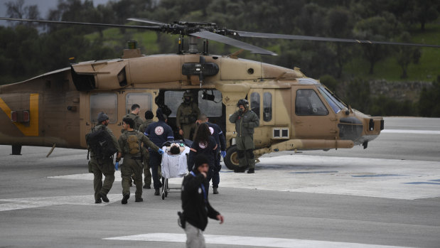 An Israeli medical team evacuates a person injured by a missile fired from Lebanon, to Ziv Hospital in Safed, northern Israel.