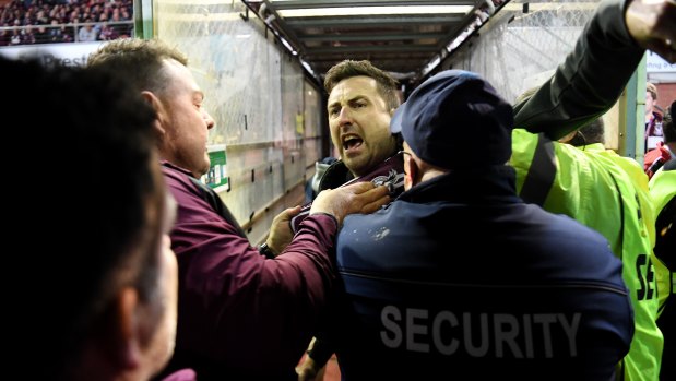 Security and police swooped on a Manly fan, centre, who confronted Melbourne Storm’s Will Chambers on Saturday night at Lottoland.