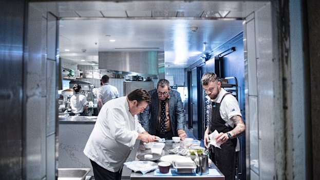 John Fink (centre) watches over as Peter Gilmore prepares a tasting menu
for the new restaurant. 