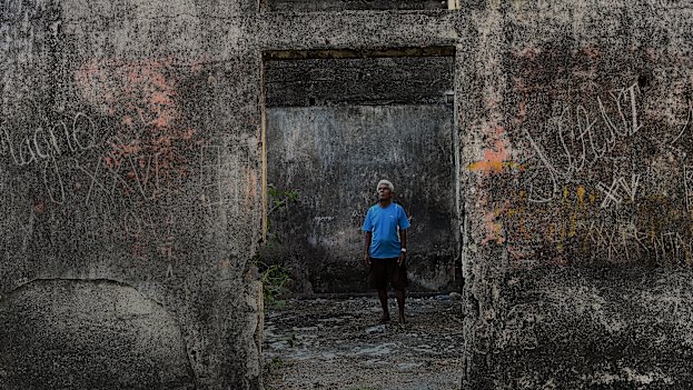 Fernando de Carvalho, 82, at the house behind which the bodies of the Balibo Five Australian-based journalists were burnt. 