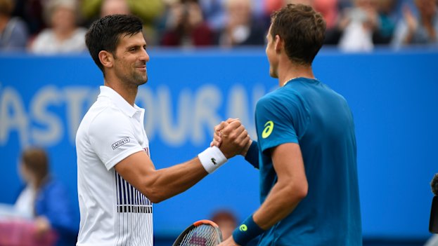 Novak Djokovic of Serbia shakes hands with Vasek Pospisil of Canada after a match in England. The duo are united in their belief in a players’ union.