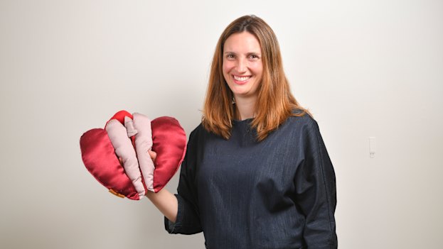 Occupational therapist Anita Brown-Major and her satin vulva puppet, which she uses in teaching.