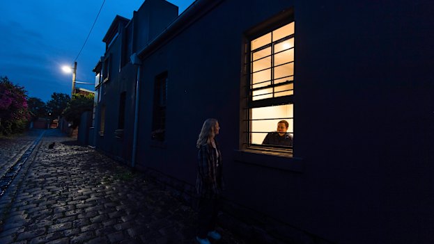 Close friend and neighbour Olivia McLeod making one of her regular visits to chat at Tom's window.