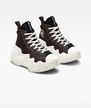 Harvey gets a boost from her high-top Converse “Run Star Motion” sneakers.