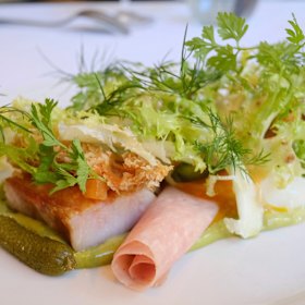 Salad Lyonnaise with cornichons, tarragon and smoked bacon.