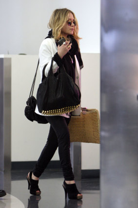 Mary Kate Olsen holding a bag from Net-A-Porter's top styles.