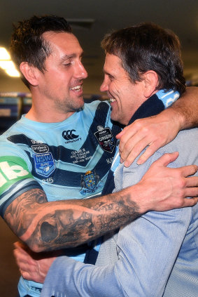 Mitchell Pearce of the Blues embraces his father Wayne following their series-sealing win over the Maroons.