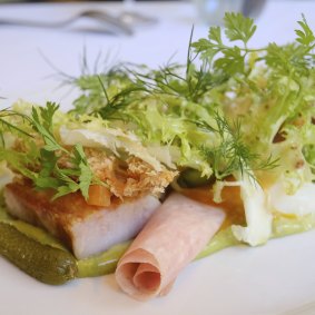 Salad Lyonnaise with cornichons, tarragon and smoked bacon.