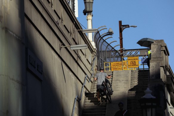 Cyclists use the Harbour Bridge Stairs in Milsons Point.