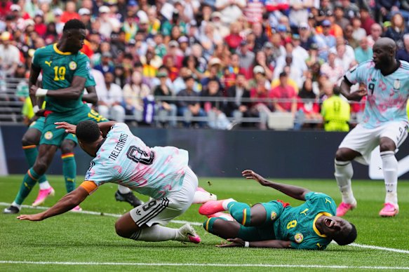 Senegal’s Lamine Camara tackles Belgium’s Youri Tielemans which results in a penalty kick to Belgium.