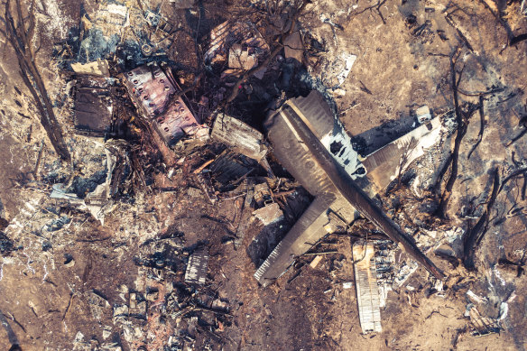 The tail of the C-130 Hercules that crashed on Thursday lies amid debris in southern NSW.