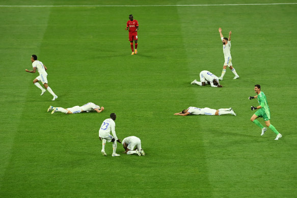 Players of Real Madrid celebrate as the final whistle is blown to confirm them as winners of the UEFA Champions League.