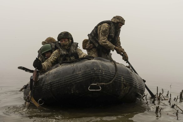A group of Ukrainian marines sail from the riverbank of Dnipro at the frontline near Kherson, Ukraine.