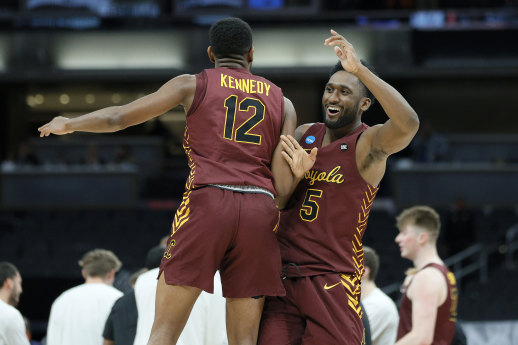 Loyola’s Marquise Kennedy and Keith Clemons celebrate their win.