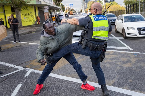 After hours of peaceful protest, a scuffle broke out with police.