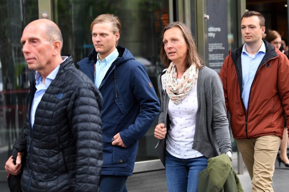 The family and former partner Thomas Kleinegris (second from left) of Dutch cyclist Gitta Scheenhouwer leaves the County Court in Melbourne