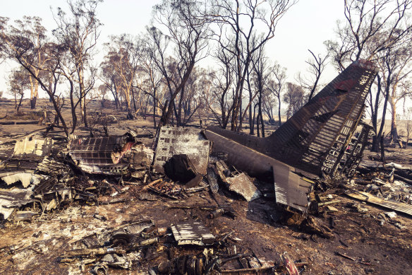 "Indescribable": The tail section of the C-130 Hercules is all that remains identifiable after the water bomber crashed near Cooma on Thursday.