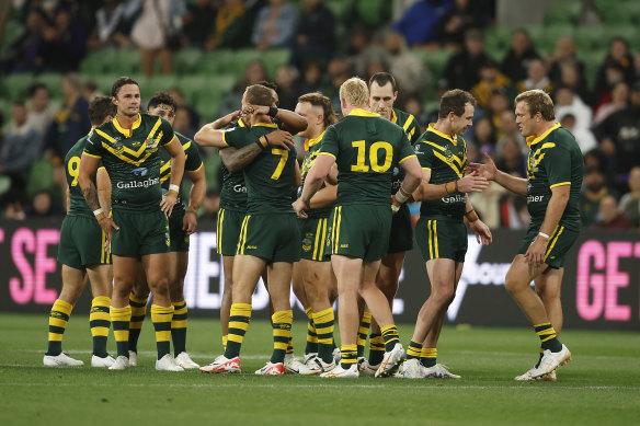 The Kangaroos celebrate victory at full time.