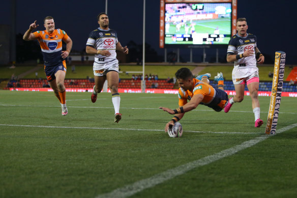 Enari Tuala scores one of the Knights' two tries in their forgettable NRL win over North Queensland.