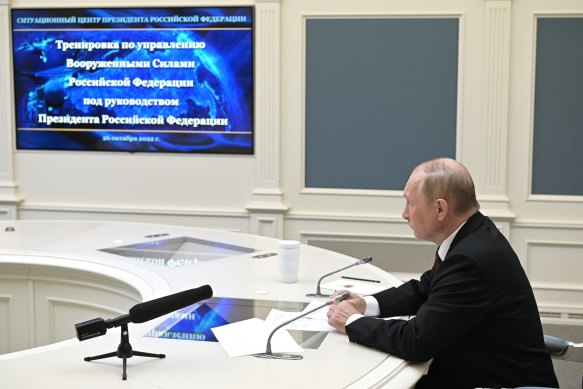 Russian President Vladimir Putin watches a training to test the strategic deterrence forces via videoconference in Moscow.