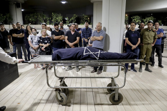 Mourners attend the funeral of Leah Yom Tov, 63, who was killed when a rocket fired from the Gaza Strip hit her house in Rishon Lezion, Israel.