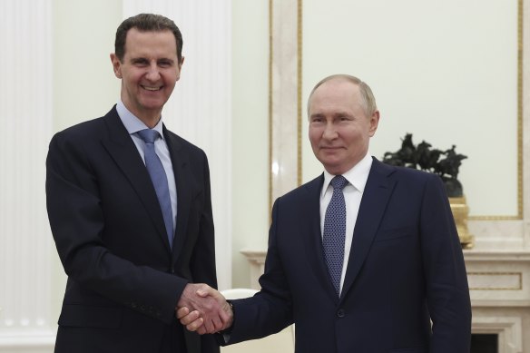 Bashar al-Assad and with ally Vladimir Putin at a meeting in Moscow in July.