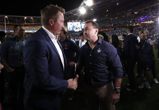 Roosters coach Trent Robinson and Raiders coach Ricky Stuart chat after last year's grand final.