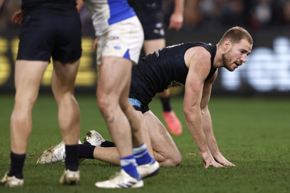 Carlton’s Harry McKay on all fours after copping a knock in the third quarter against North Melbourne.