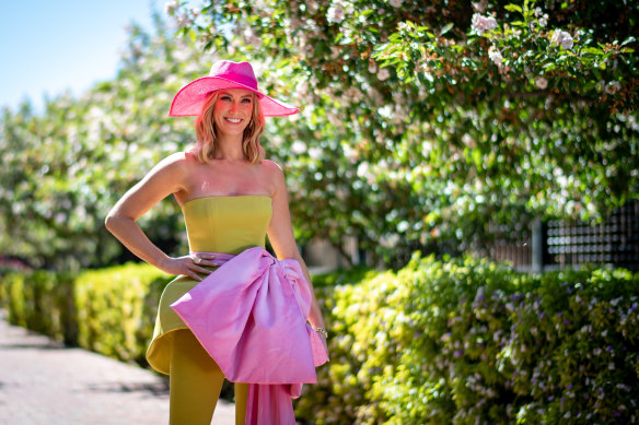 Delta Goodrem chose a lime green jumpsuit by Mariam Seddiq for the Melbourne Cup.