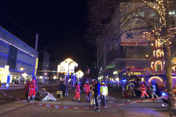 Emergency services attend an incident at the Christmas market in Magdeburg, Germany, on Friday .