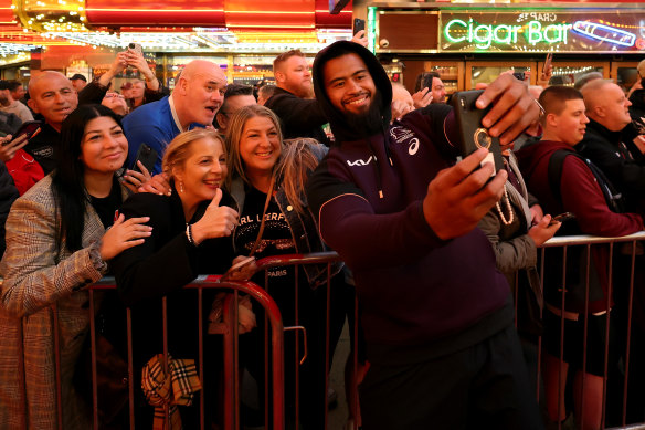 Meanwhile, in Downtown Las Vegas: Broncos powerhouse prop Payne Haas poses with fans 