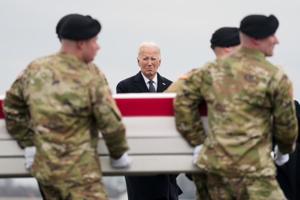 President Joe Biden stands as an Army carry team moves the transfer case containing the remains of US Army Sergeant Breonna Alexsondria Moffett, one of three killed in the attack in Jordan. 