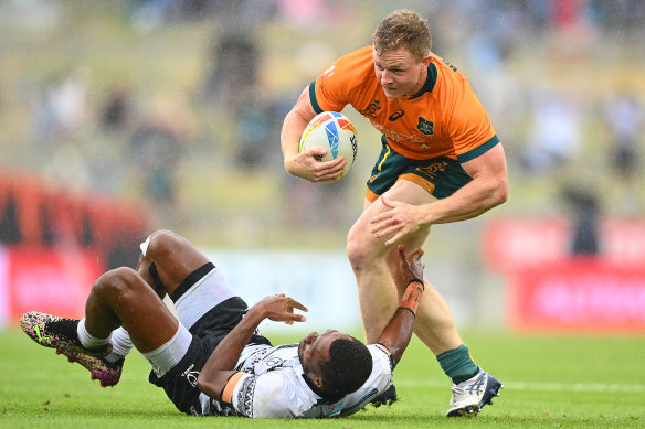 Henry Hutchison breaks a tackle against Fiji in Hamilton.