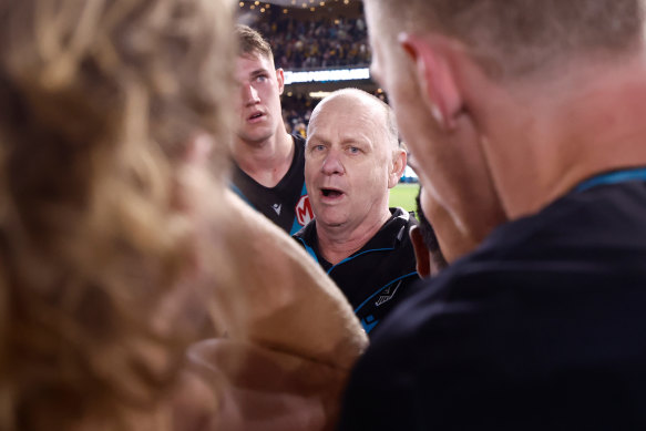 Power coach Ken Hinkley speaks to his players.