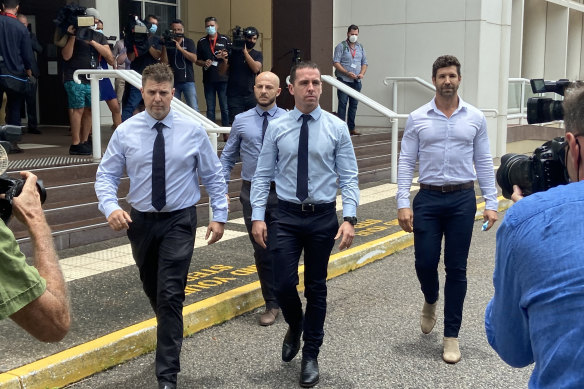 Constable Zachary Rolfe (front and centre) leaving court on the first day of his trial for the murder of 19-year-old Kumanjayi Walker. 