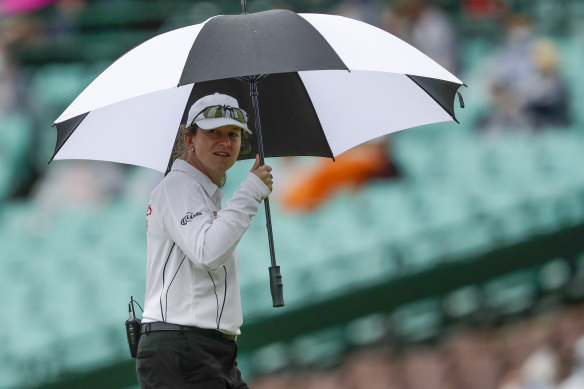 Claire Polosak inspects conditions after rain stops play during a Test match at the Sydney Cricket Ground.