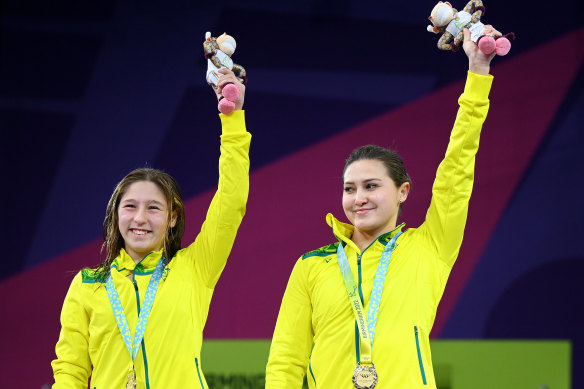 Charli Petrov and Melissa Wu of Team Australia pose with their gold medals in the women’s synchronised 10m platform.