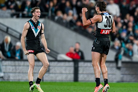 Ollie Lord of the Power celebrates a goal  with Jack Whitlock of the Power.