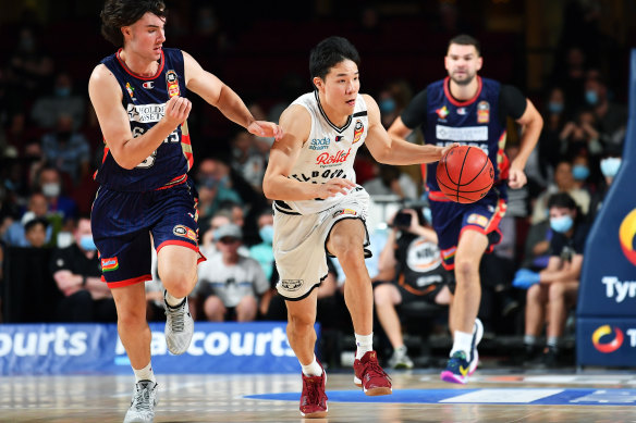 Yudai Baba on the run for Melbourne United in their clash with the Adelaide 36ers earlier this month.