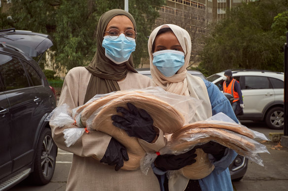 AMSSA volunteers distributing food during the public housing lockdowns in July 2020.