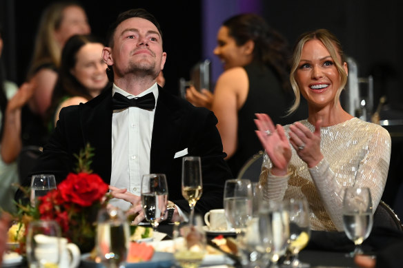 Lachie Neale and his wife Julie react to the win.