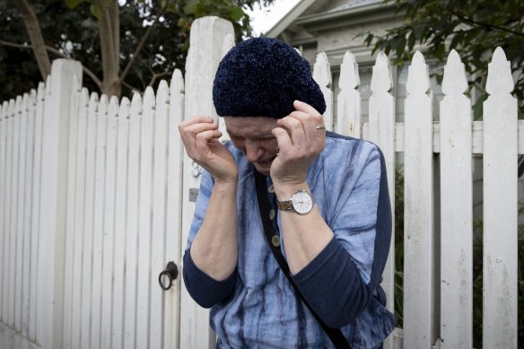 A community member mourning outside the burned synagogue on Friday.