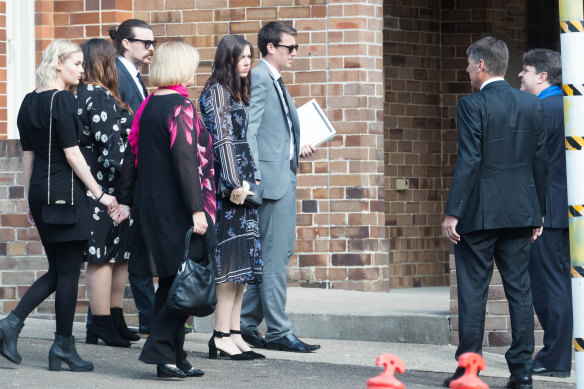 Mourners at Turramurra Uniting Church for the memorial service include his father, Stephen, second from right, and mother, Shaunagh, left with pink scarf. 