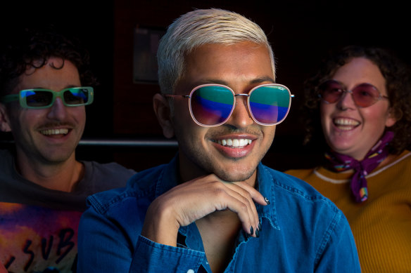Meg-an Windred and Adrian Murdoch from LGBTQIA+ organisation Minus 18 and activist Dom Thattil (centre). wearing Quay Australia sunglasses from their Pride collection.