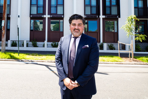 Stephen Gaitanos outside the student accommodation building that has just been built but will be mothballed because of continued international border closures this year. 